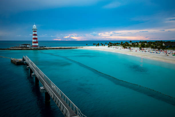 istock A foreland with a lighthouse on exotic location with a bridge visually leading to it 1395326753