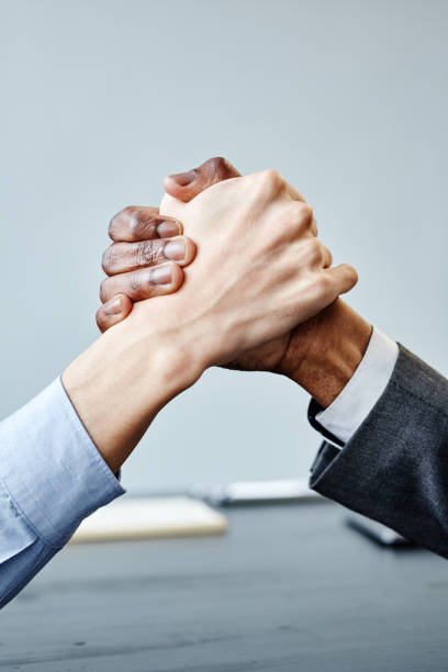 istock Business Partners Shaking Hands in Meeting 1395329986