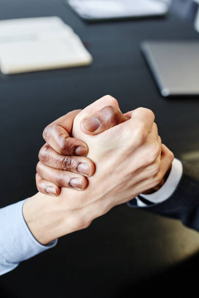 istock Business Partners Shaking Hands Top View 1395329991