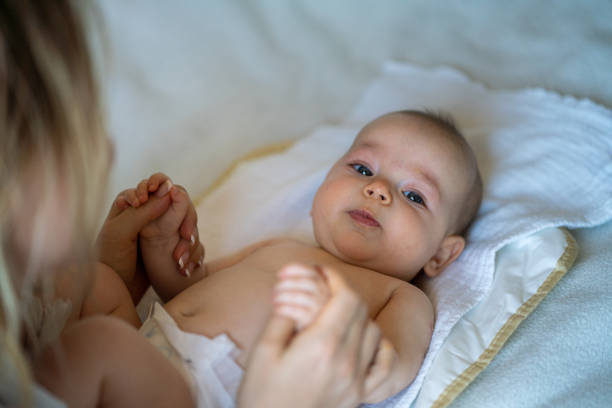istock Baby and mother at home 1395330831