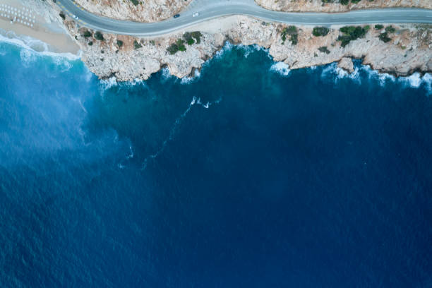 istock Aerial view of waves splashing on beach 1395332865
