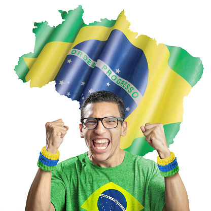 Soccer fan national team of Brazil celebrating goal in front of brazilian flag on map