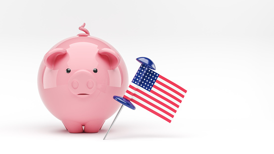 Piggybank and the American flag. On white color background. Horizontal composition. ısolated with clipping path