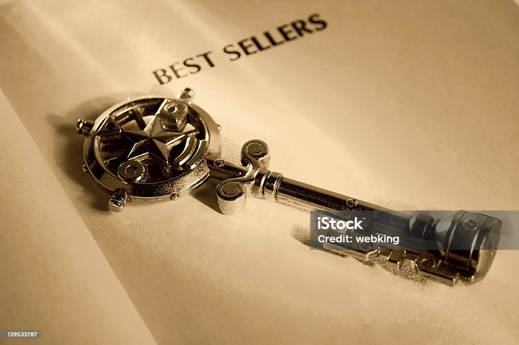 Key To a Best Seller Key and a Book.  Key To a Best Seller Concept. Book Stock Photo
