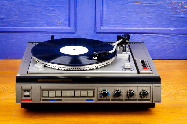 istock Vintage turntable vinyl record player with black vinyl 1395338697