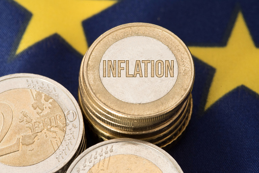 Flag of the European Union EU, euro coins and inflation