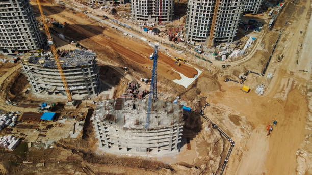 istock Large construction site. Construction of modern multi-storey residential buildings. Construction of apartment buildings from concrete and glass. Aerial photography. 1395339087