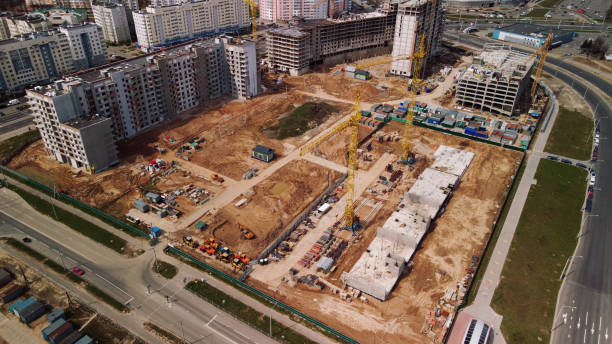 istock Large construction site. Construction of modern multi-storey residential buildings. Construction of apartment buildings from concrete and glass. Aerial photography. 1395339305
