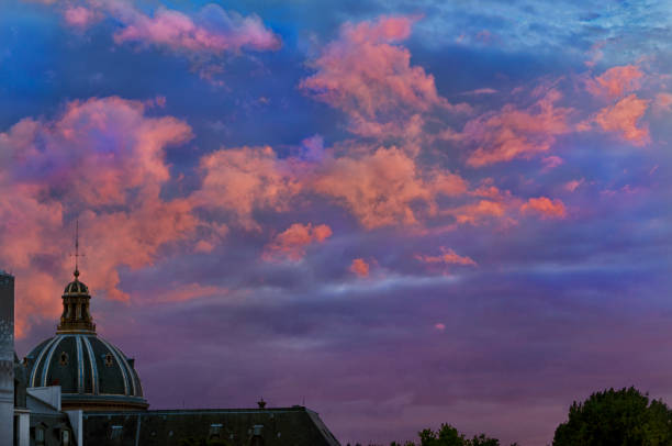 istock Orange clouds floating above l’Institut de France at sunset 1395339945