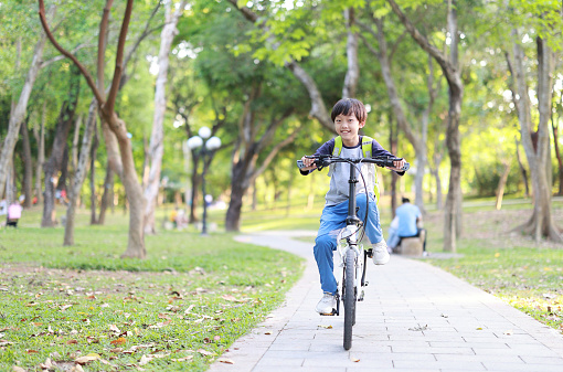 Boy start to ride a bicycle
