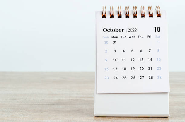 istock October 2022 desk calendar on wooden background. 1395341323