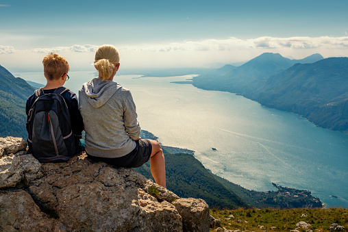 mother and son looking down to Lake Garda in Italy