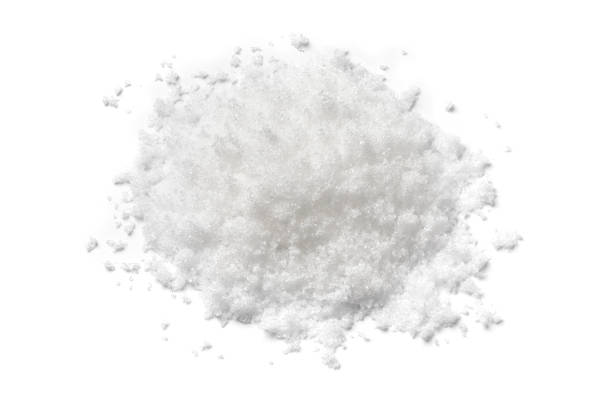 istock Heap of soft white sugar close up on white background 1395343029