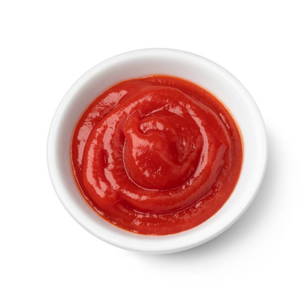 istock Bowl with tomato ketchup on white background 1395343204