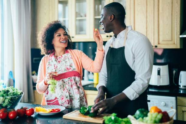 istock Mixed race couple cooking at home 1395345066