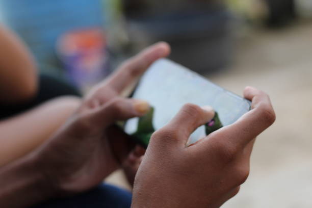 istock The hand of a person playing a game 1395345329