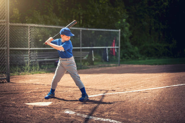 baseball - - baseball hitting baseball player child stock-fotos und bilder