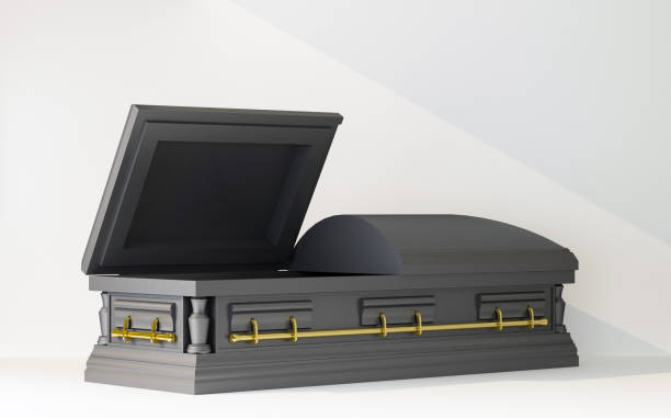 istock open part of black coffin in beam of light 1395347497