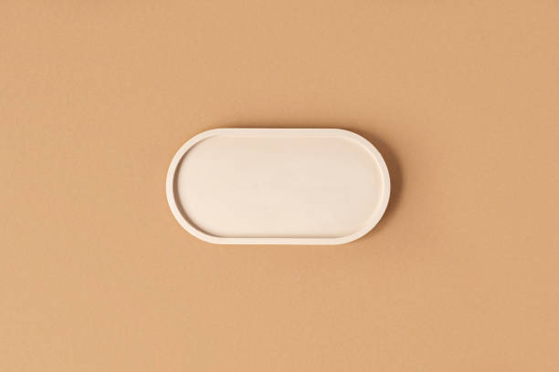 istock Podium for product presentation. Abstract minimal geometrical form on beige background. Oval stone form. Scene, Showcase, display. Minimal design. Trendy soft shadow. Flat lay, Top View. 1395348344