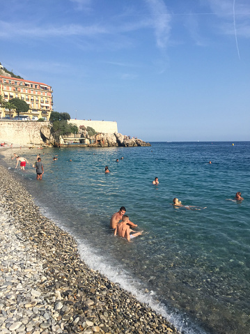 Nice, France- July 6, 2015: Nice is an import beach holiday destination in the coastline of Mediterranean Sea, South France. Here is the beach and city view.