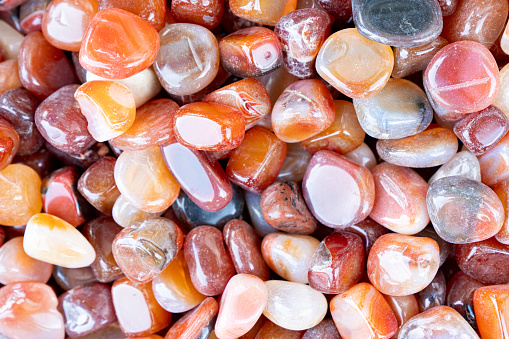 Closeup of various colorful stones quartz, marbles, ore minerals, gems use as ornament and decoration jewelry that contain spiritual force human believes