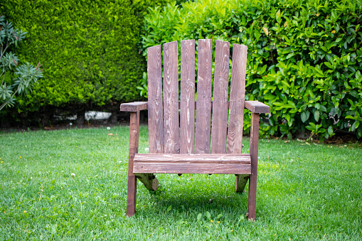 Wooden chair on the grass. Nature concept.