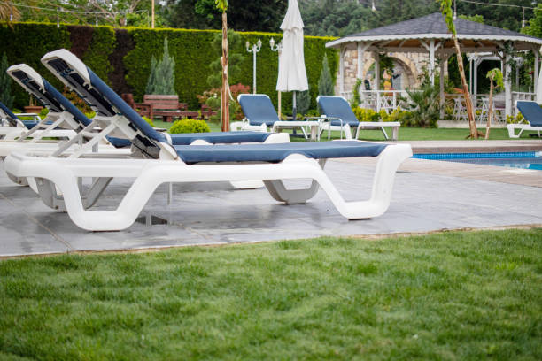 Sun loungers by the pool. Hotel and vacation concept.
