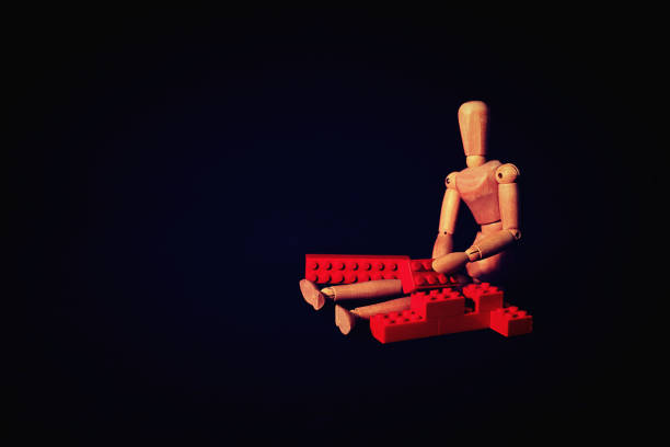 wooden mannequin is creative with building blocks