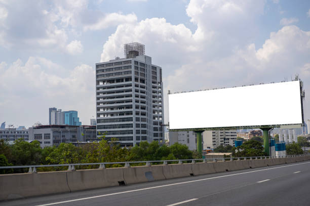 istock Billboard canvas mockup in city background. beautiful weather 1395354427