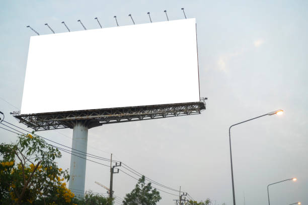 istock Blank white billboard against the blue sky 1395354428