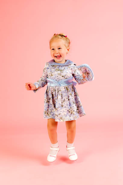 istock cheerful girl on a pink background 1395354636