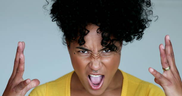 istock Angry young hispanic black woman shouting 1395354773