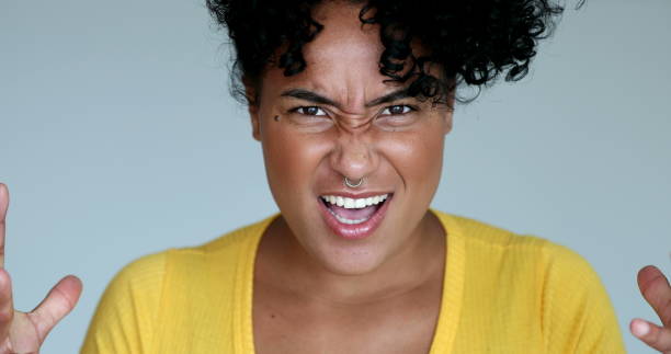 istock Angry young hispanic black woman shouting 1395354854