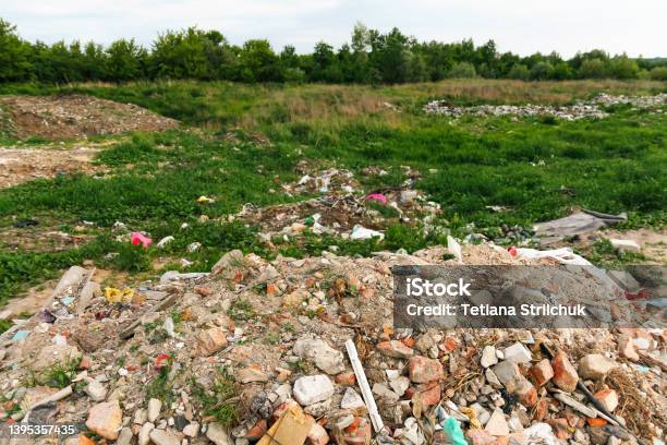 Defocus Huge Ruins Wreck In Ukraine War House After Russian Attack Large Garbage Pile On Nature Green Grass Background Global Warming Pollution Abstract Background Kyiv Home Out Of Focus Stock Photo - Download Image Now