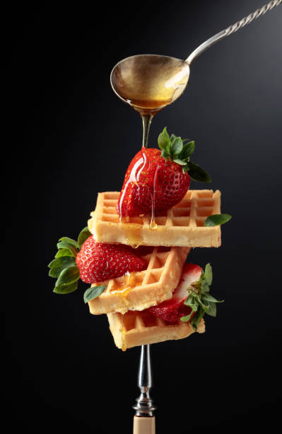 istock Waffles with strawberries and honey. 1395358469