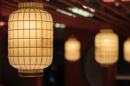 close up white traditional Chinese paper lantern at dark night