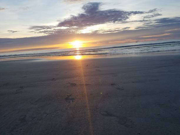 istock Morning sunrise over the ocean horizon 1395358624