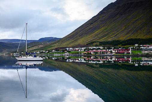 Early evening reflection on the port of Ísafjörður and surrounding mountains, Westfjords, Iceland