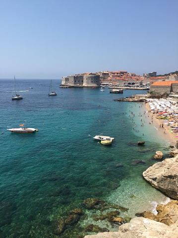 Dubrovnik, Croatia- July 18, 2015: Croatia is a country never lack of good beaches. The Adriatic sea has gifted many attractions in the country. Here is the beach clos e to the old city of Dubrovnik.