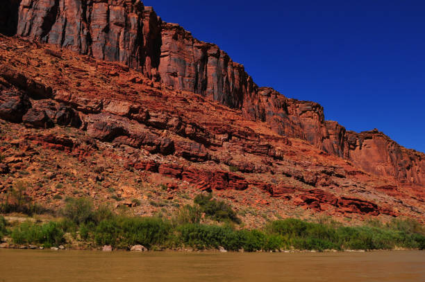 istock Red sandstone cliffs on the Colorado river 1395360198