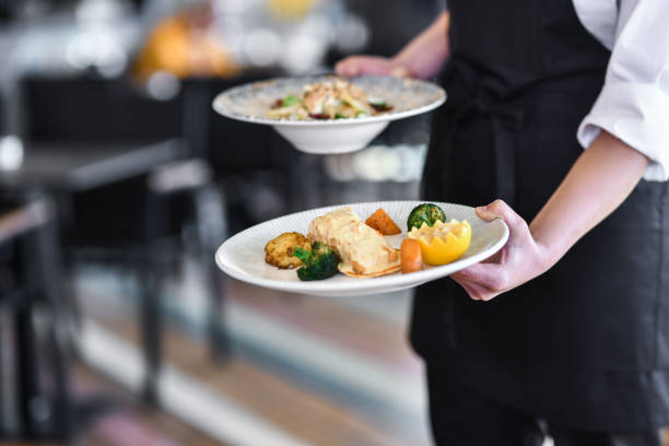 istock Elegant Food Artwork Brought By Waitress In Restaurant 1395362111