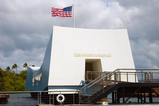 Flag flying over USS Arizona Memorial.