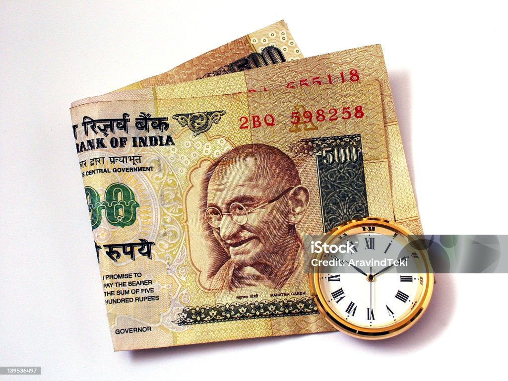 Time and Money Time and Indian Money Indian Currency Stock Photo