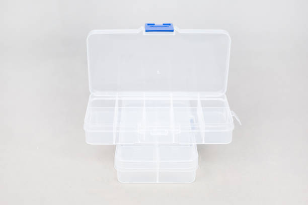 istock Plastic transparent boxes with individual cells with a blue lid on a white background 1395366569