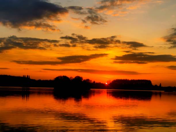istock Sunset and reflection on the lake 1395366619