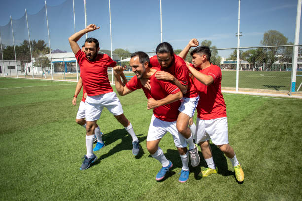 istock Friends playing soccer 1395367475