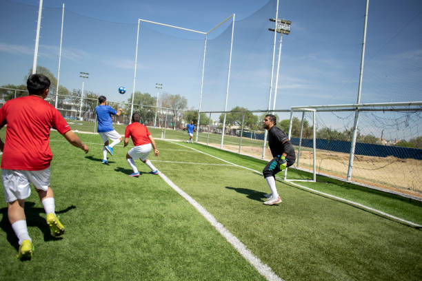 istock Friends playing soccer 1395367499