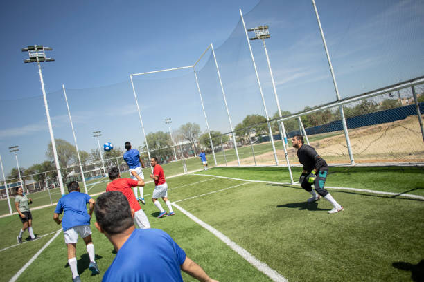 istock Friends playing soccer 1395367502