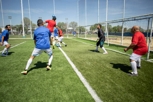 istock Friends playing soccer 1395367503