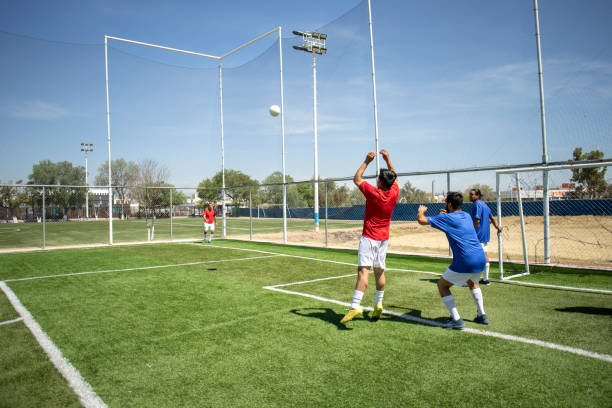 istock Friends playing soccer 1395367505